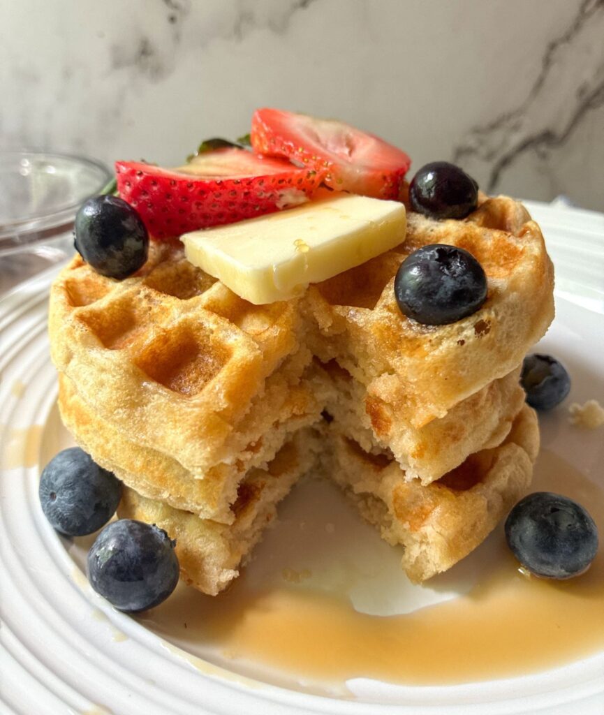 eggless waffles with a slice taken out