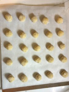 eggless sugar cookie dough balls on a baking sheet