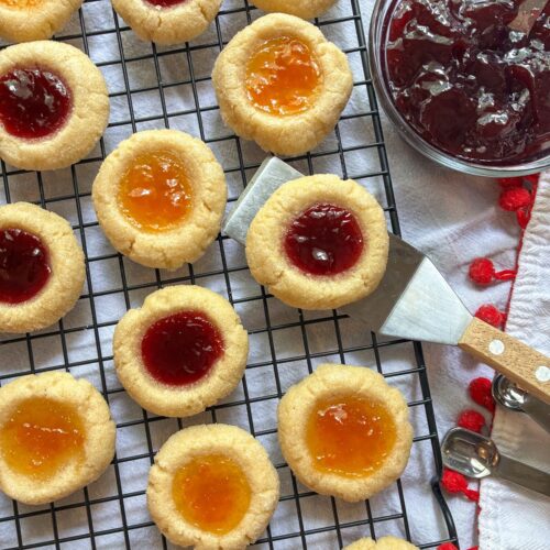 eggless thumb print cookies on a cooling rack