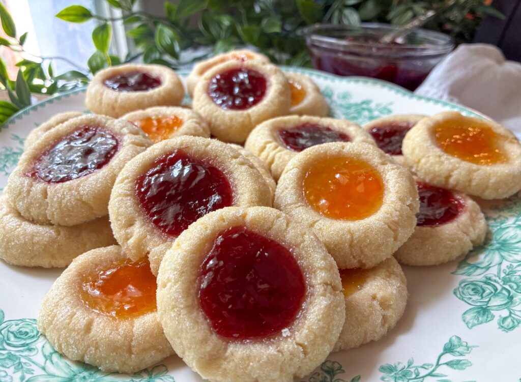 eggless jam thumbprint cookies piled on a plate