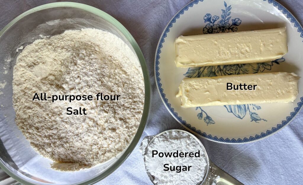 ingredients for eggless cookies in bowls on a table
