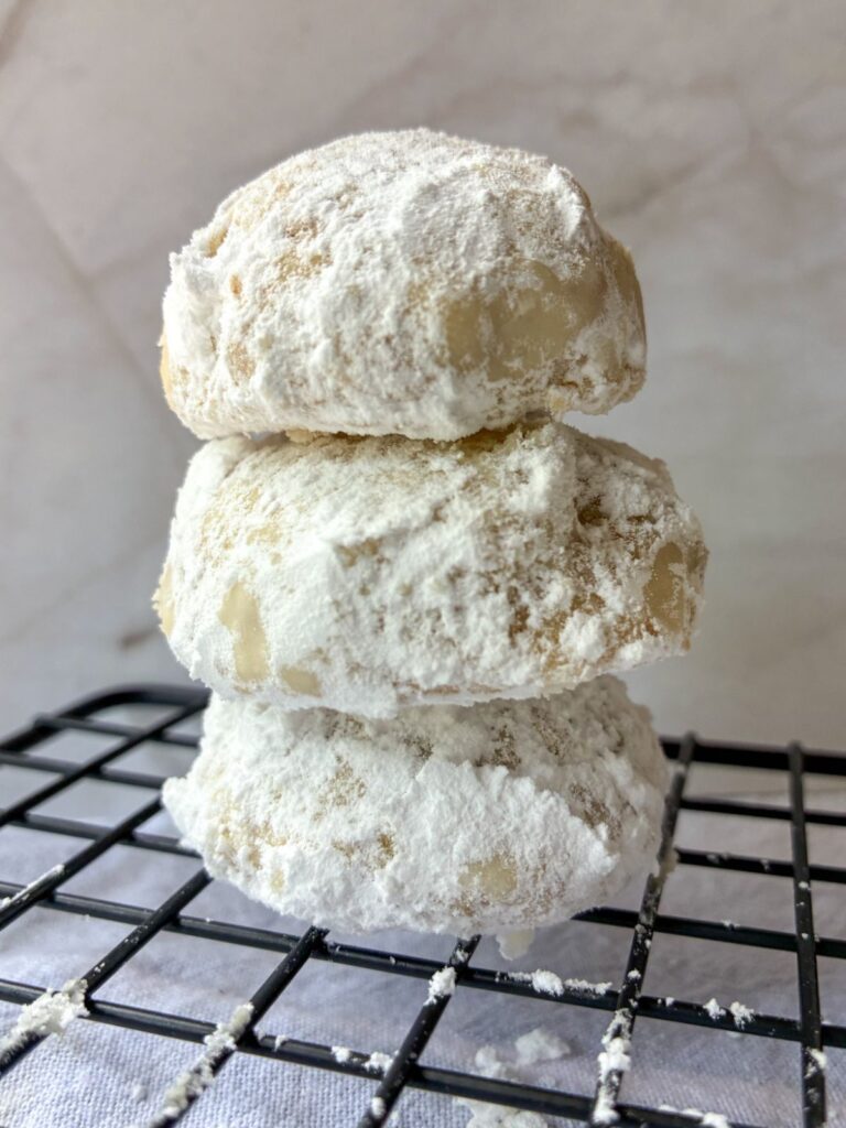 Three snowball cookies stacked on top of each other