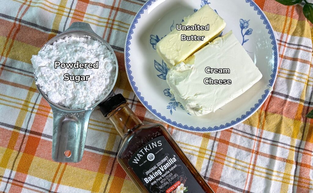 ingredients for cream cheese frosting laid out on a table