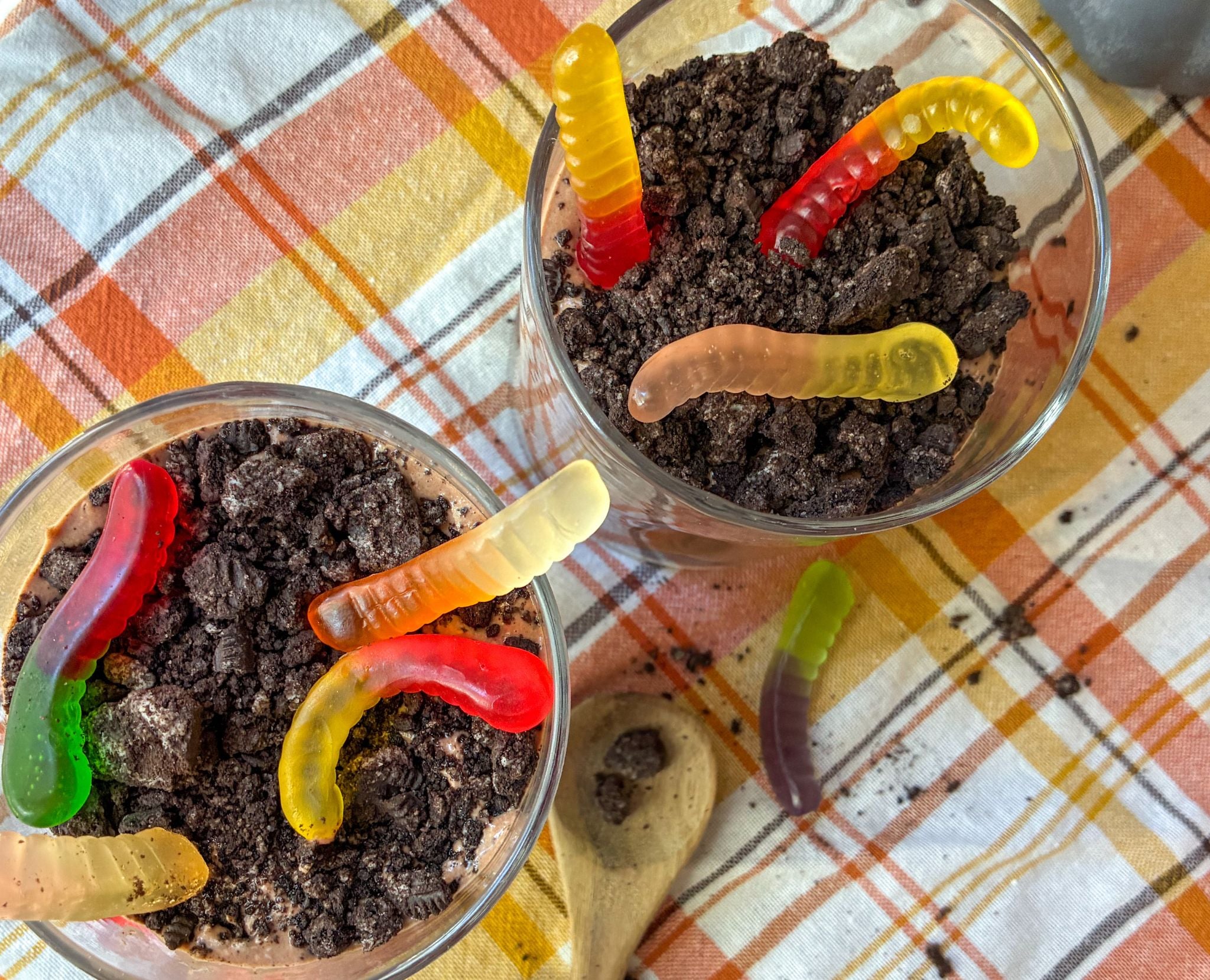 Overhead view of cottage cheese dirt cups with Oreo dirt and colorful gummy worms