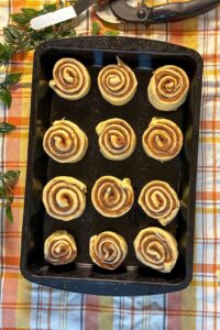 eggless cinnamon rolls in a baking pan