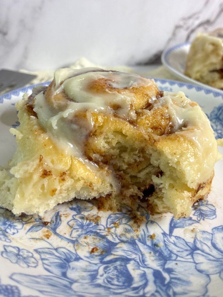 eggless cinnamon roll with a bite taken out
