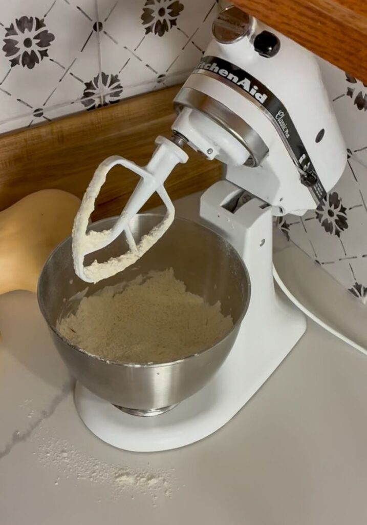 stand mixer with flour mixture in a large bowl