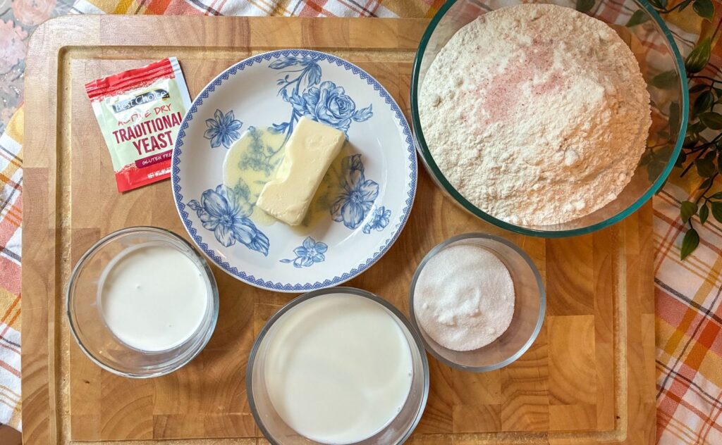 ingredients in eggless cinnamon rolls laid out in bowls and on a plate